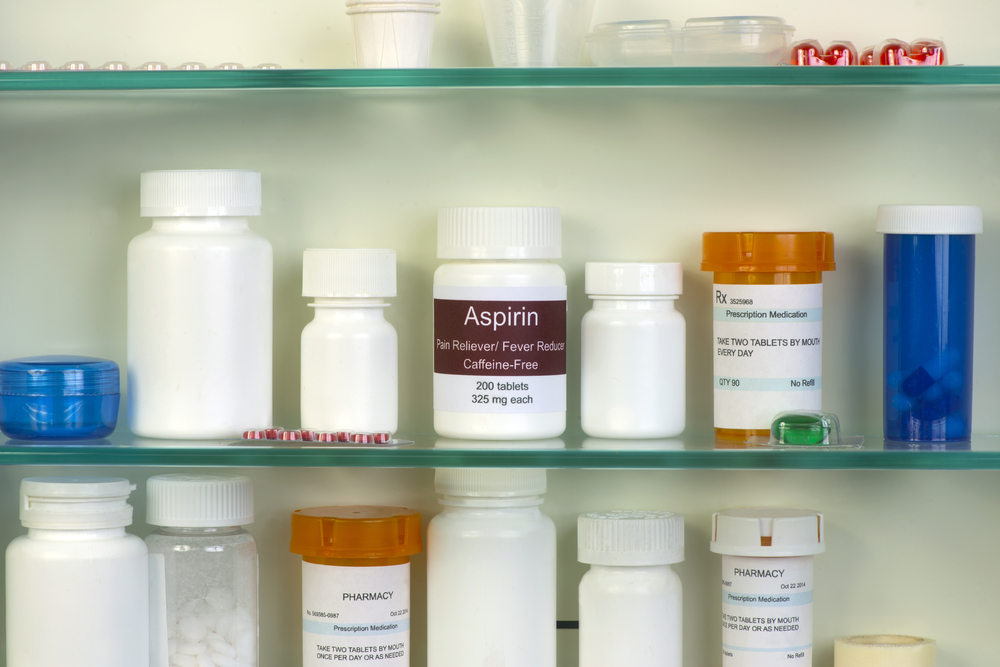 Medicine bottle in cabinet illustrating pet medication safety and the dangers of human drugs for animals